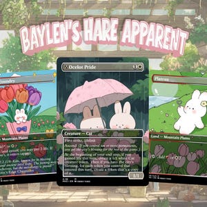 May include: Three trading cards titled Baylen's Hare Apparent featuring cartoon illustrations. The left card shows tulips and a small rabbit, the center card depicts two rabbits under a pink umbrella, and the right card shows a white rabbit in a field.