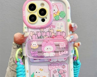Capa fofa de coelhinho e patinho para iPhone, com suporte deslizante para a câmera, alça transversal trançada removível e resistente a impactos para iPhone 17/16/15/14/13 Pro Max.