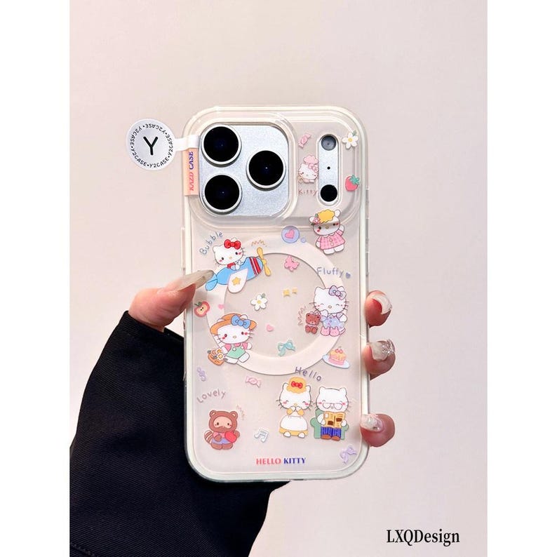 May include: A clear phone case featuring multiple Hello Kitty character illustrations, including Hello Kitty in a plane, wearing a hat, and sitting with a friend. The case includes text such as Bubble, Fluffy, Lovely, and Hello Kitty, with a circular magnetic ring.