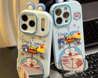 Capa para iPhone com orelhas 3D do Doraemon, estampa de desenho animado, capa resistente a impactos com suporte flip espelhado para iPhone 17/16/15/14/13 Pro Max.