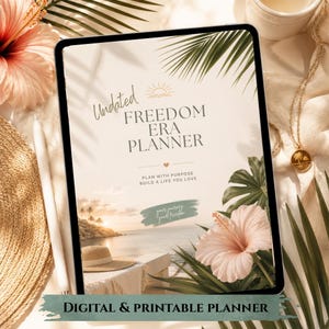 May include: A digital tablet displaying a planner cover titled Undated Freedom Era Planner with a tropical beach scene, palm leaves, and a hibiscus flower. The text reads Plan with Purpose Build a Life You Love and Digital & Printable Planner.
