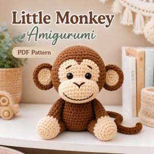 May include: A crocheted monkey amigurumi toy with dark brown fur, a light beige face, ears, hands, and feet, featuring black safety eyes and a stitched smile. The text Little Monkey Amigurumi PDF Pattern is displayed above the toy.