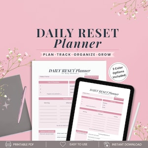May include: A Daily Reset Planner with a pink background, featuring a printable page and a tablet screen displaying the same layout. The planner includes sections for Today's Focus, Top 3 Priorities, Today's Flow, and Lessons Learned, with a pen.