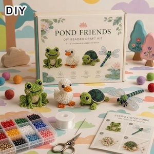 May include: A Pond Friends DIY beaded craft kit box featuring illustrations of a frog, duck, turtle, and dragonfly. The set includes finished beaded figures, a clear plastic organizer with colorful beads, a spool of thread, scissors, and a guide.