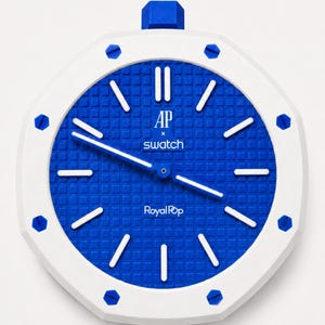 May include: A wall clock featuring a white octagonal frame with blue screw accents and a blue textured dial. The face displays white hour markers, white hands, and the text AP x swatch and Royal Pop printed in white on the center of the dial.