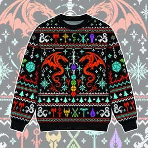 May include: A black long-sleeve jumper featuring a colourful knit pattern with two large red dragons facing a central sword. The design includes various gaming icons, dice, and geometric shapes in shades of red, teal, yellow, and purple against a black background.