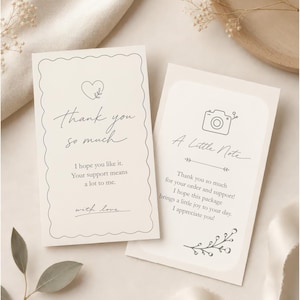 May include: Two rectangular off-white thank you cards with dark gray text and line art. The left card features a heart, the text "thank you so much", "I hope you like it. Your support means a lot to me.", and "with love.". The right card shows a camera icon, "A Little Note", and a message of appreciation.