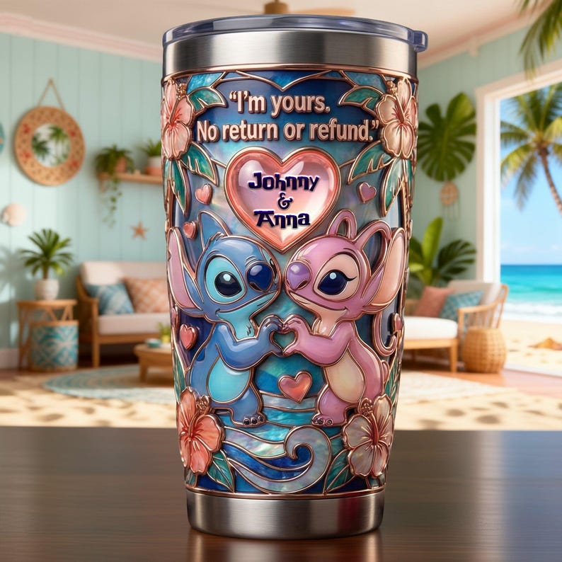 May include: A stainless steel tumbler featuring a blue and pink alien character design with hibiscus flowers and a heart. The text reads, "I'm yours. No return or refund." and "Johnny & Anna" inside a central heart. The finish has a stained glass effect.