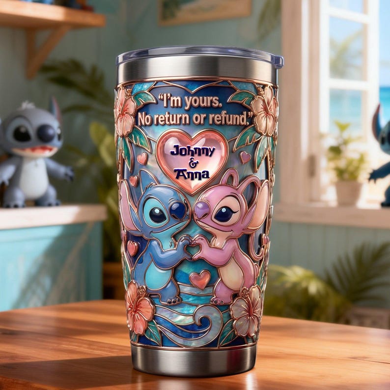 May include: A stainless steel tumbler featuring a blue and pink alien character design with hibiscus flowers. The text reads, "I'm yours. No return or refund." and "Johnny & Anna" inside a heart. The design has a stained glass appearance.