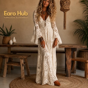 May include: A floor-length cream-colored lace dress featuring long bell sleeves, a deep V-neckline, and a fitted bodice with a textured floral pattern. The garment includes the text Earo Hub TIMELESS ELEGANCE printed in the upper left corner.
