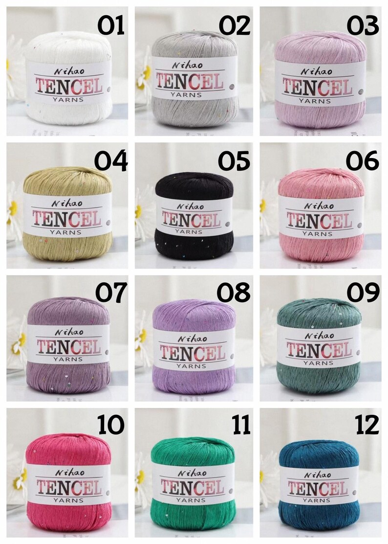 May include: A collection of twelve cylindrical yarn skeins in various colors, each wrapped in a white paper band labeled Nihao TENCEL YARNS. The yarn colors include white, gray, pink, gold, black, rose, purple, lavender, teal, magenta, green, and blue.