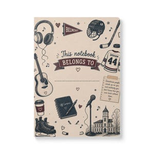 May include: A beige notebook cover featuring dark blue and maroon illustrations of headphones, a guitar, a hockey helmet, a jersey with the name Graham and number 44, a microphone, a coffee cup, and a building. Text reads This notebook BELONGS TO.