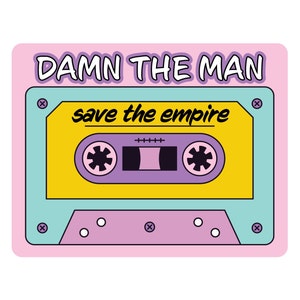 May include: A pink cassette tape with a yellow centre and a purple cassette. The tape has the text "DAMN THE MAN save the empire" on it.