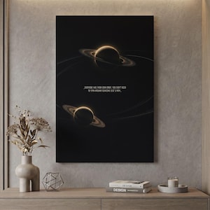 May include: A rectangular wall art print featuring two dark planets with glowing rings against a black background. The text reads: "EVERYONE HAS THEIR OWN ORBIT. YOU DON'T NEED TO SPIN AROUND SOMEONE ELSE'S PATH."