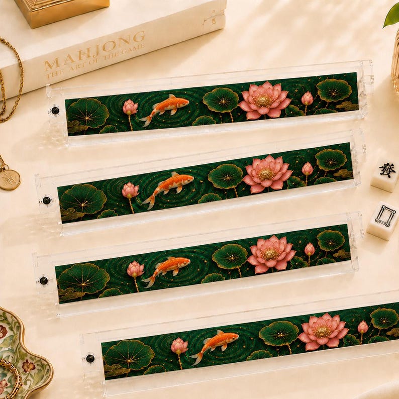 May include: Four clear acrylic mahjong tile racks featuring a printed design of orange koi fish swimming among pink lotus flowers and dark green lily pads. Each rectangular rack has a small black screw on the left side for assembly.