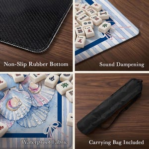 May include: A mahjong mat featuring a blue and white seashell pattern with a non-slip black rubber bottom, sound dampening properties, and waterproof fabric. The set includes a black carrying bag for storage and transport of the game mat.