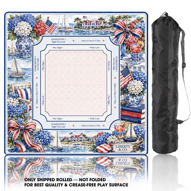 May include: A square mahjong play mat featuring a nautical theme with blue and white hydrangeas, sailboats, American flags, and red, white, and blue bows. The center has game instructions and text including Liberty & Co. A black carrying bag is included.