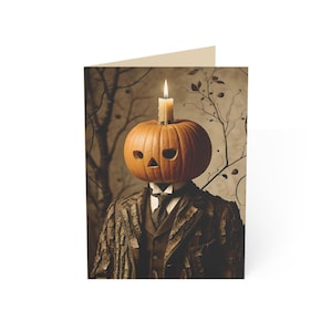 May include: A greeting card featuring a figure with a carved orange pumpkin head topped with a lit candle. The figure wears a suit jacket with a textured bark-like pattern, a dark vest, a white collared shirt, and a dark necktie against a muted background.