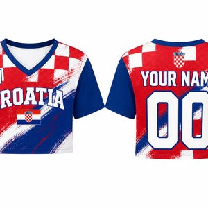 May include: A short-sleeved crop top jersey featuring the red and white Croatian checkerboard pattern, blue sleeves, and a V-neck. The front displays the text CROATIA, the number 10, and a flag. The back shows the text YOUR NAME and the number 00.