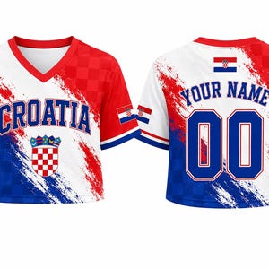 May include: A V-neck crop top jersey featuring a red, white, and blue color scheme with a checkerboard pattern. The front displays the text CROATIA and the national coat of arms. The back shows the text YOUR NAME and the number 00.