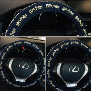 May include: A blue and white patterned steering wheel cover with the words "Harry Potter" in a repeating pattern. The cover is designed to fit over a car's steering wheel, enhancing its appearance.