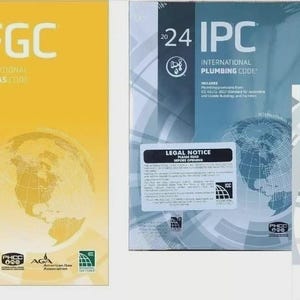 May include: Three technical reference books including the 2024 IFGC International Fuel Gas Code in yellow, the 2024 IPC International Plumbing Code in blue, and a set of BBI Fast-Tabs for the 2024 IPC, all featuring globe graphics and text.