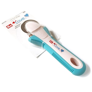 May include: A blue and white rotary cutter with a heart design and the word "Love" on the handle. The cutter is 45mm in diameter.