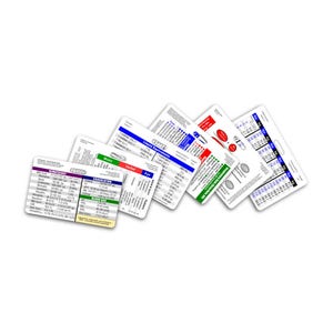 May include: A collection of rectangular medical reference cards, each with detailed text and color-coded sections. The cards display information on hematology, liquid equivalents, and emergency dose calculations. The cards are white with various colored text.