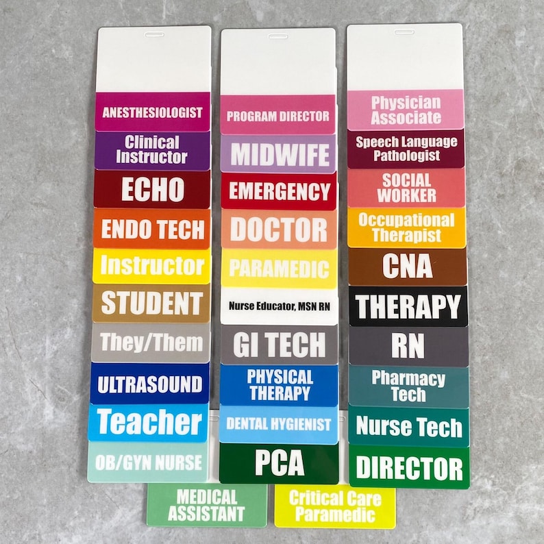 May include: A set of colorful name tags with various medical and healthcare job titles printed on them. The tags are arranged in three columns, with each column representing a different category of healthcare professional. The categories are: Anesthesiologist, Program Director, and Physician Associate. The tags are made of a durable plastic material and are designed to be easily attached to clothing.