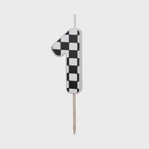 May include: A number one shaped birthday candle featuring a black and white chequered pattern across its front surface. The candle includes a single white wick at the top and a thin wooden pick extending from the bottom for insertion into a cake.