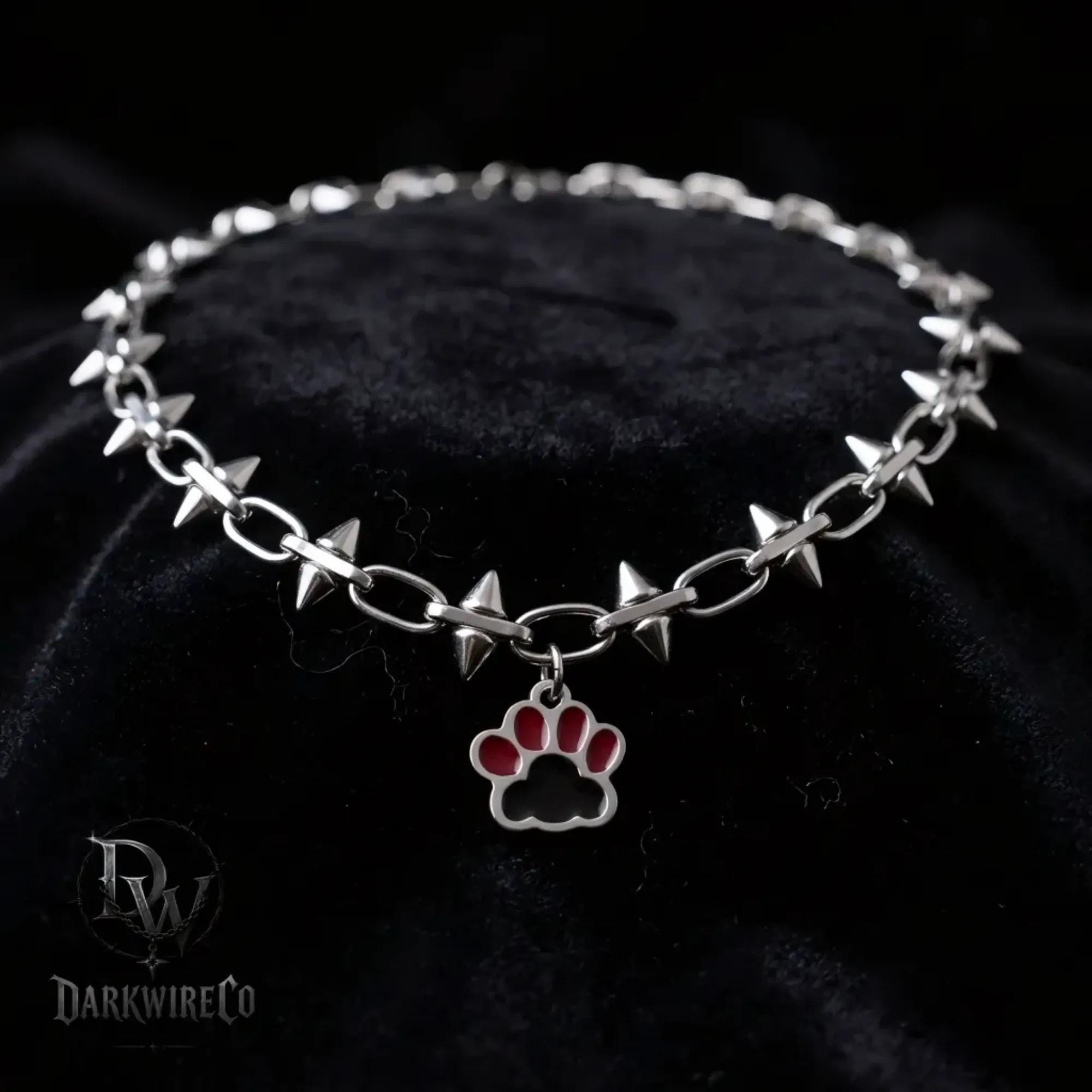 Spiked paw choker
