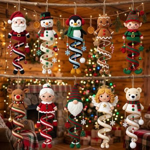 May include: A collection of ten crocheted Christmas ornaments hanging from a wooden branch. The figures include Santa Claus, a snowman, a penguin, a gingerbread person, an elf, a reindeer, Mrs. Claus, a gnome, an angel, and a polar bear.