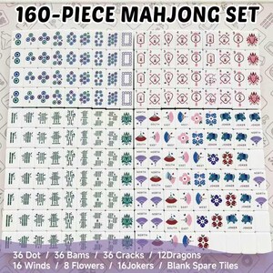 May include: A 160-piece mahjong set featuring white tiles with colorful engraved designs. The set includes dot, bam, and crack suits, dragon tiles, wind tiles, flower tiles, joker tiles, and blank spare tiles with various patterns.
