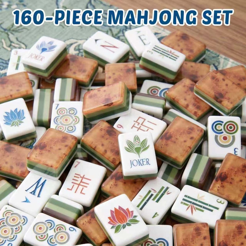 May include: A 160-piece mahjong set featuring rectangular tiles with white faces and brown, wood-grain patterned backs. The tiles display various colorful illustrations, including lotus flowers, bamboo stalks, circular patterns, and the word JOKER.