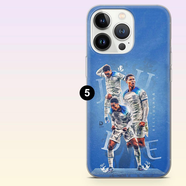 May include: A blue smartphone case featuring a graphic print of a soccer player in a white uniform in three different poses. The text "JUDE" and "BELLINGHAM" is visible in the background, along with the number 5 in a black circle.