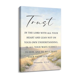 May include: A rectangular canvas wall art piece featuring a landscape painting of a dirt path winding through a grassy field under a pale sky. The text "Trust IN THE LORD WITH ALL YOUR HEART AND LEAN NOT ON YOUR OWN UNDERSTANDING; IN ALL YOUR WAYS SUBMIT TO HIM, AND HE WILL MAKE YOUR PATHS STRAIGHT. Proverbs 3:5-6" is printed in black.