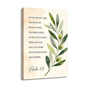 May include: A rectangular canvas wall art piece featuring a watercolor olive branch with green leaves and olives on the right side. The background is a light cream color with soft tan watercolor washes. Black text reads Psalm 1:3 and the verse.