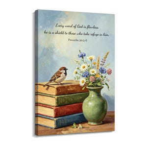 May include: A canvas print featuring a brown sparrow perched on a stack of four books in tan, green, red, and blue. Beside the books sits a sage green vase filled with wildflowers. The text reads: Every word of God is flawless: he is a shield to those who take refuge in him. Proverbs 30:5-6.