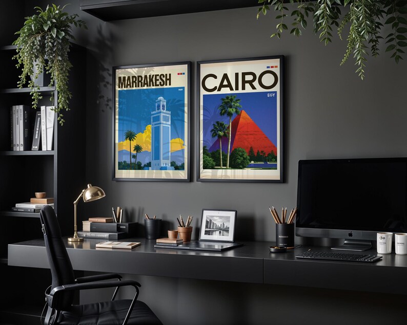 May include: Two framed travel posters hanging on a dark wall. The left poster features a blue tower in Marrakesh with palm trees and yellow clouds. The right poster depicts the red pyramids of Cairo with palm trees and the text CAIRO EGY.