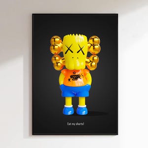 May include: A framed wall art print featuring a yellow cartoon character with X-shaped eyes and gold bone-shaped ears. The character wears an orange shirt with black graffiti text and blue shorts. The text "Eat my shorts!" appears below.