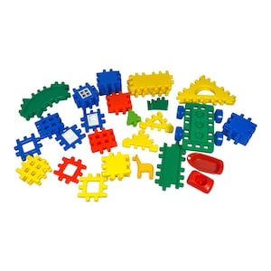May include: A collection of colorful plastic building blocks in various shapes and sizes, including squares, triangles, rectangles, and curved pieces. The set features primary colors like red, blue, yellow, and green, along with a small giraffe figure.