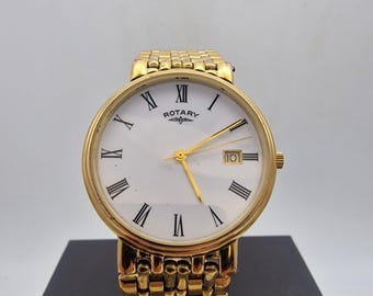 Vintage Rotary G619 Mens classic quartz dress watch.Features a gold-plated case paired with a matching five-link beads-of-rice bracelet