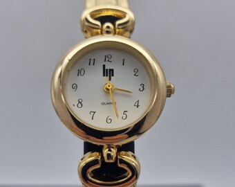 Classic hp French ladies quartz watch. Gold tonr roun shaped case