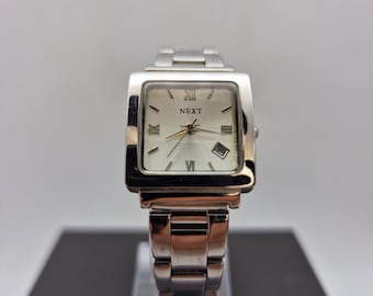Next ladies Square faced quarts watch with date, stainless steel case and bracelet