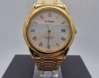 Vintage Sekonda Gold-Tone Men’s Quartz Watch with Date Window, deployment bracelet.