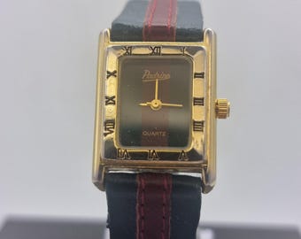 Vintage striking Padrino quartz dress watch, striped Red and green leatet strap, Toman numeral bezel