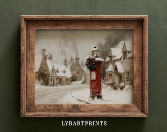 May include: A framed art print featuring a snowy village scene with a bright red pillar box adorned with a festive wreath in the foreground. The image depicts stone cottages under a winter sky, all enclosed within a rustic dark wood frame.