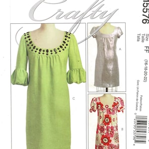 May include: McCall's Crafty sewing pattern M5576. The pattern features three dress designs. One dress is lime green with a jewel-embellished neckline and bell sleeves. The other two dresses are silver and floral print.