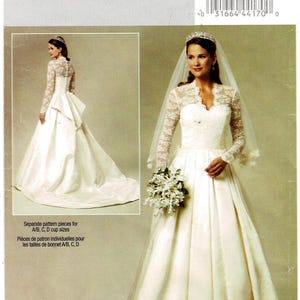May include: Butterick sewing pattern 5731 for a wedding dress with a lace bodice, long lace sleeves, and a full-length skirt. The pattern includes separate pieces for A, B, C, and D cup sizes. The envelope displays the dress from front and back views.