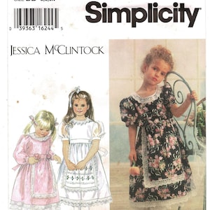 May include: Simplicity sewing pattern 9295 for size BB 5, 6, 6X, featuring Jessica McClintock designs. The pattern shows three dress variations with puff sleeves, lace trim, and apron-style overlays in floral and solid fabric options.